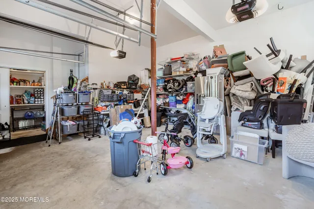 a view of a house with a big yard plants and large trees