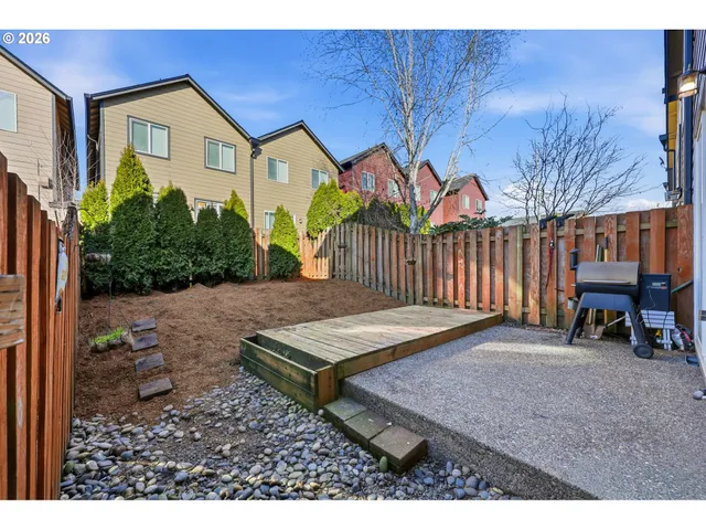 a view of front a house with wooden fence