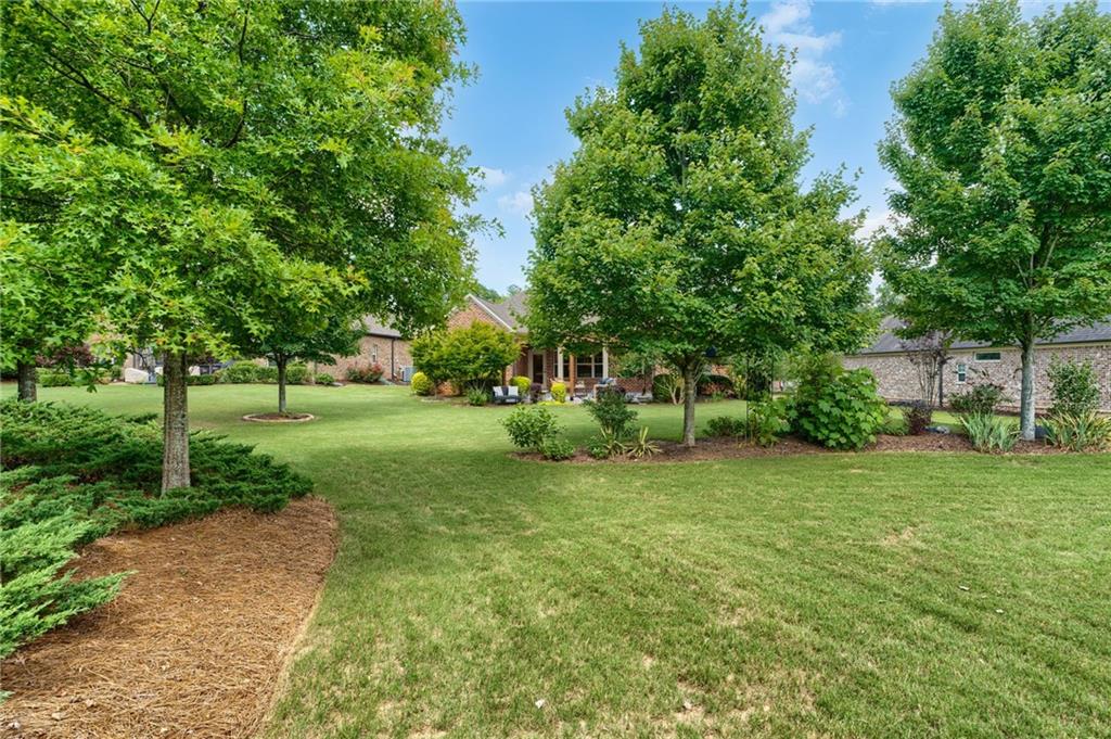 4735 Amble Trace Cumming, GA 30040 - Photo 61 of 73 a view of a house with a big yard