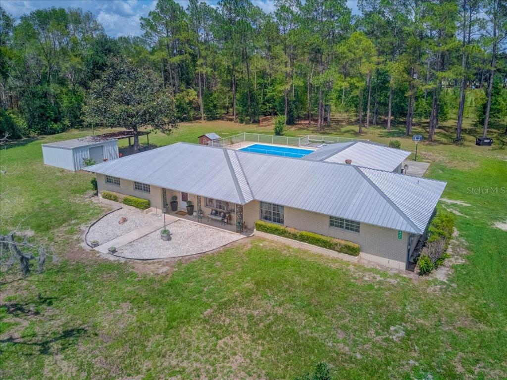 7422 County Road 231 Lake Butler, FL 32054 - Photo 47 of 57 an aerial view of a house with swimming pool and yard