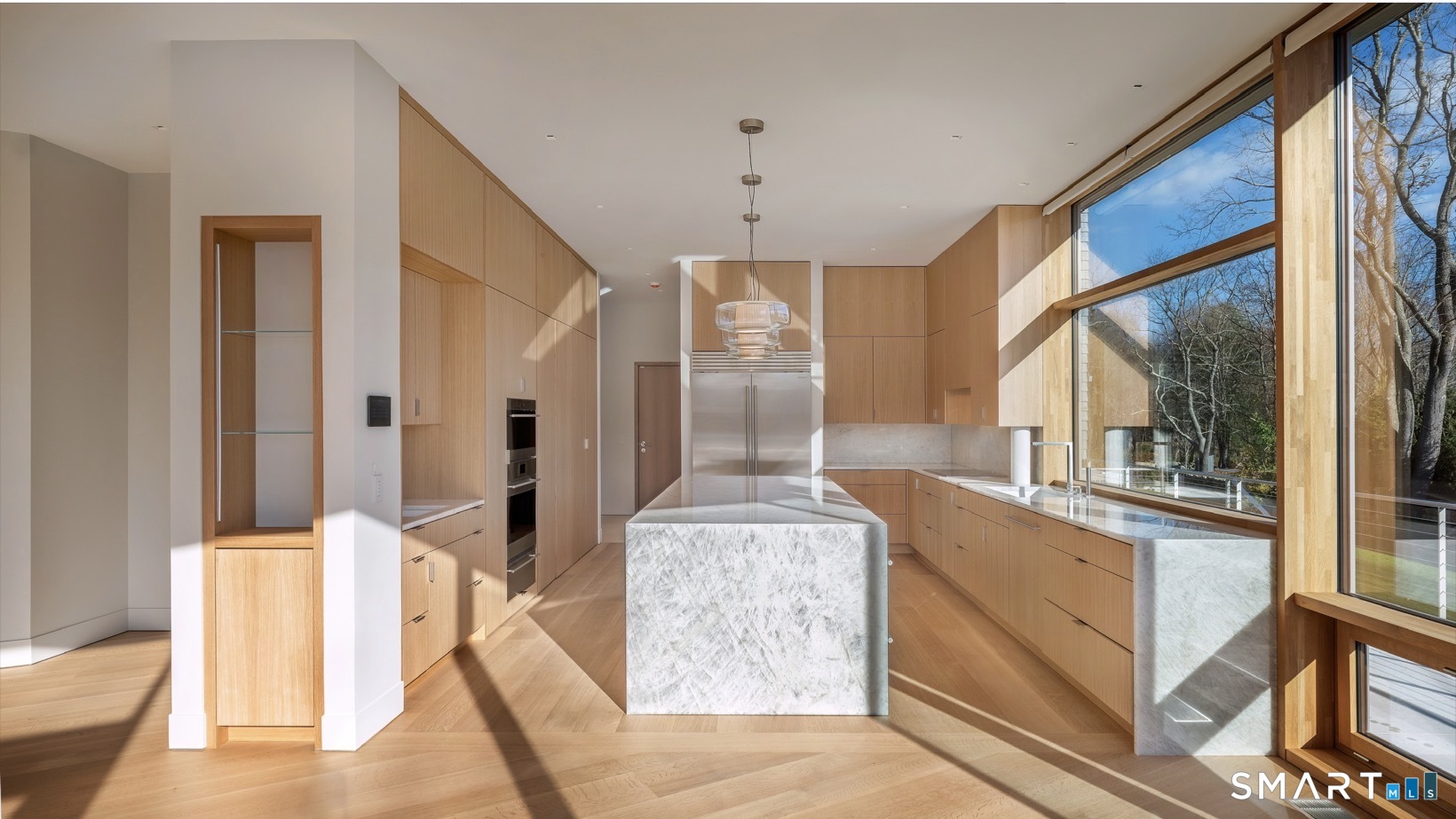 314 Ferry Road Old Lyme, CT 06371 - Photo 13 of 40 Other top appliances include a Bosch dishwasher, Zephyr wine refrigerator, a Subzero refrigerator, and separate built-in refrigerator and freezer drawers.