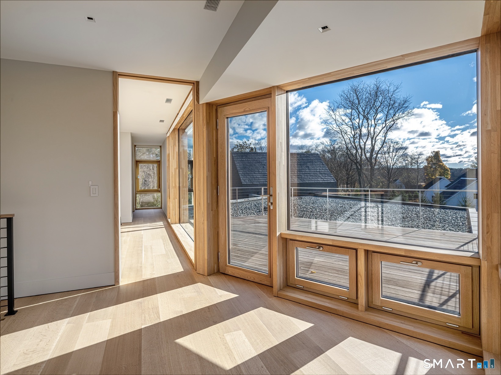 314 Ferry Road Old Lyme, CT 06371 - Photo 19 of 40 Second floor landing leads to deck area. Perfect for hosting gatherings.
