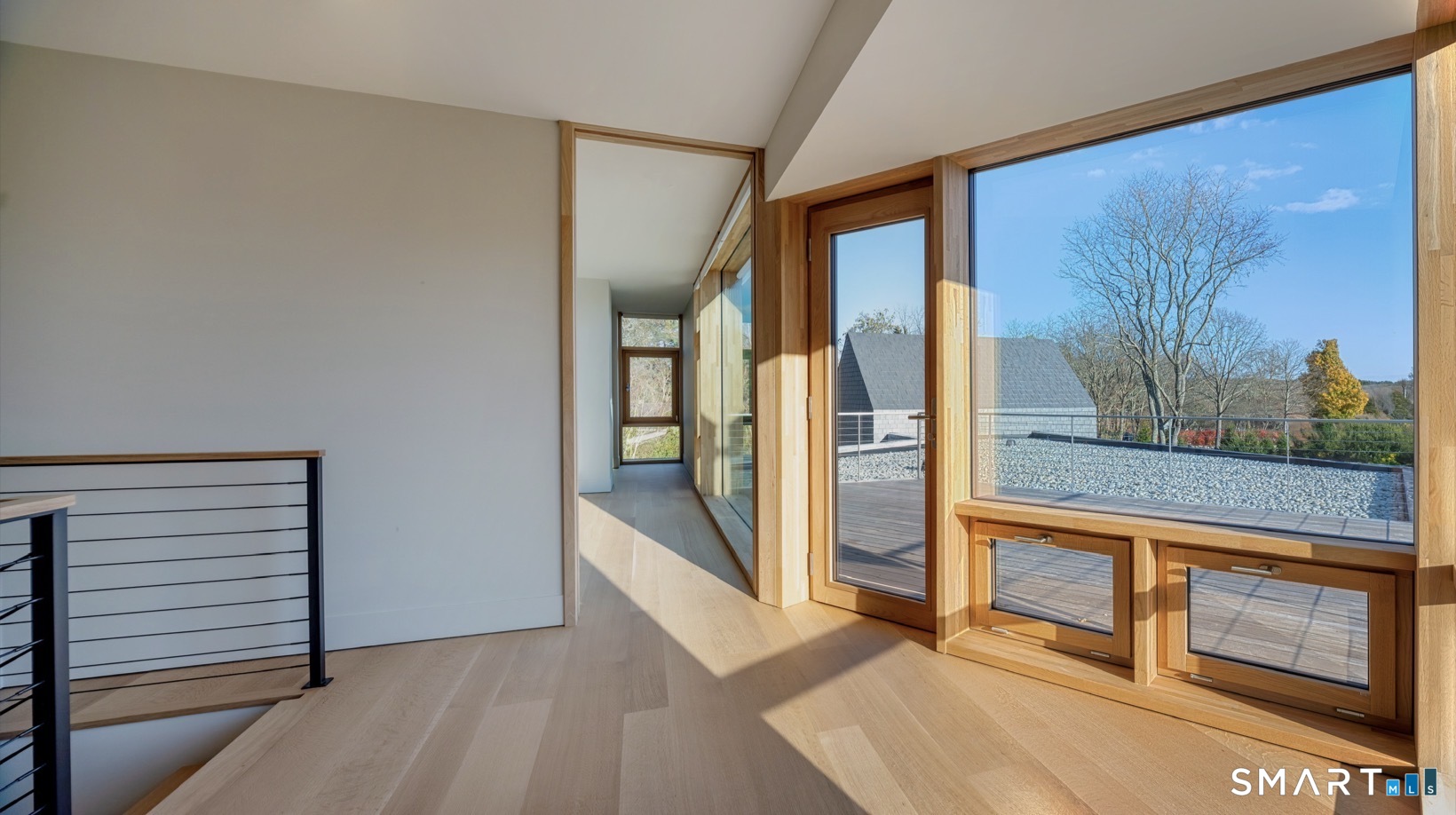 314 Ferry Road Old Lyme, CT 06371 - Photo 20 of 40 A light-colored palette enhances the interior's open airy feel. White oak window frames on the inside which are clad with gray aluminum on the outside were chosen to harmonize with the gray stone.