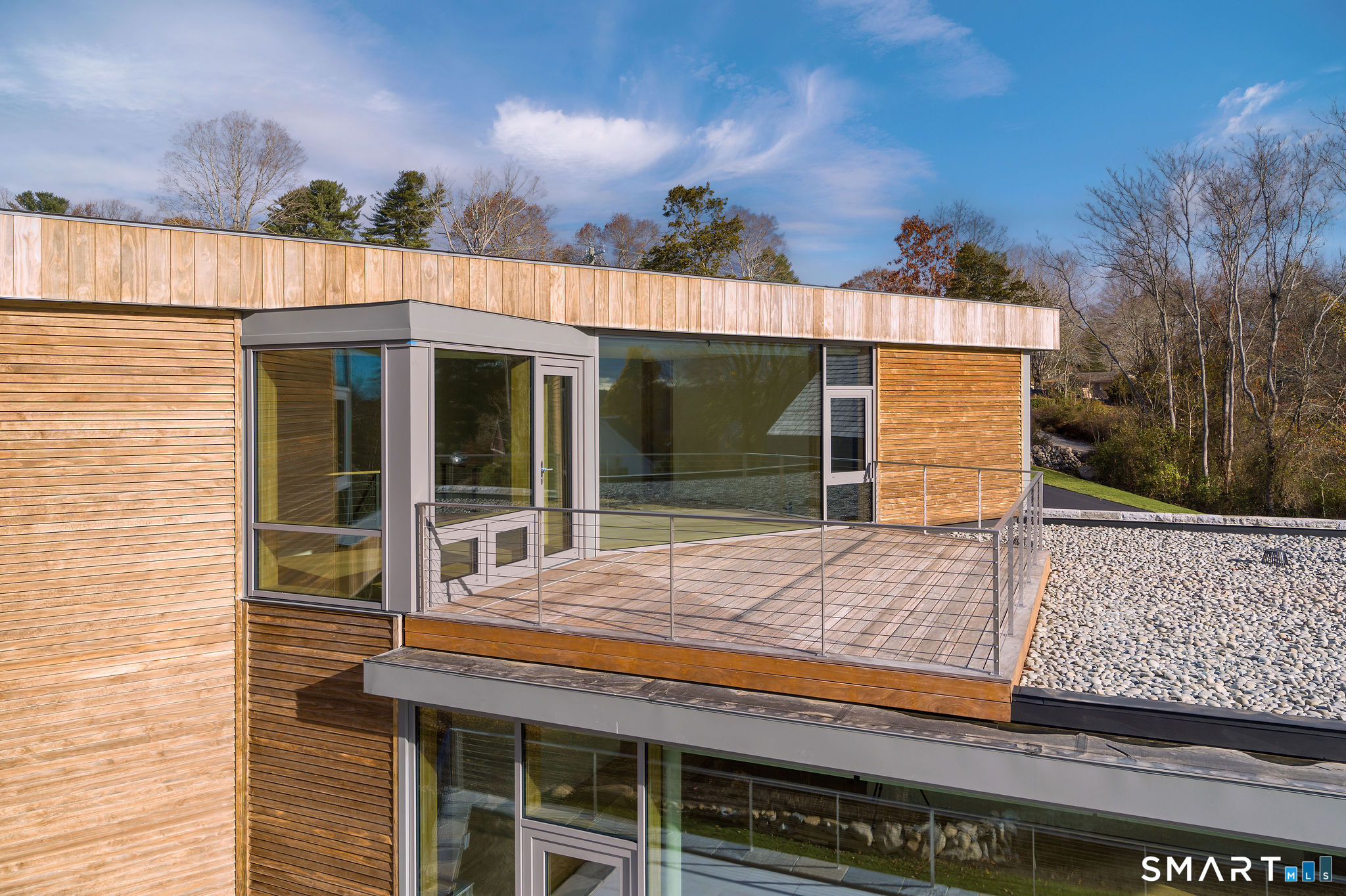 314 Ferry Road Old Lyme, CT 06371 - Photo 21 of 40 The second story IPE wood deck with cable railing is an ideal spot for relaxing and enjoying the sunshine and even more expansive views.