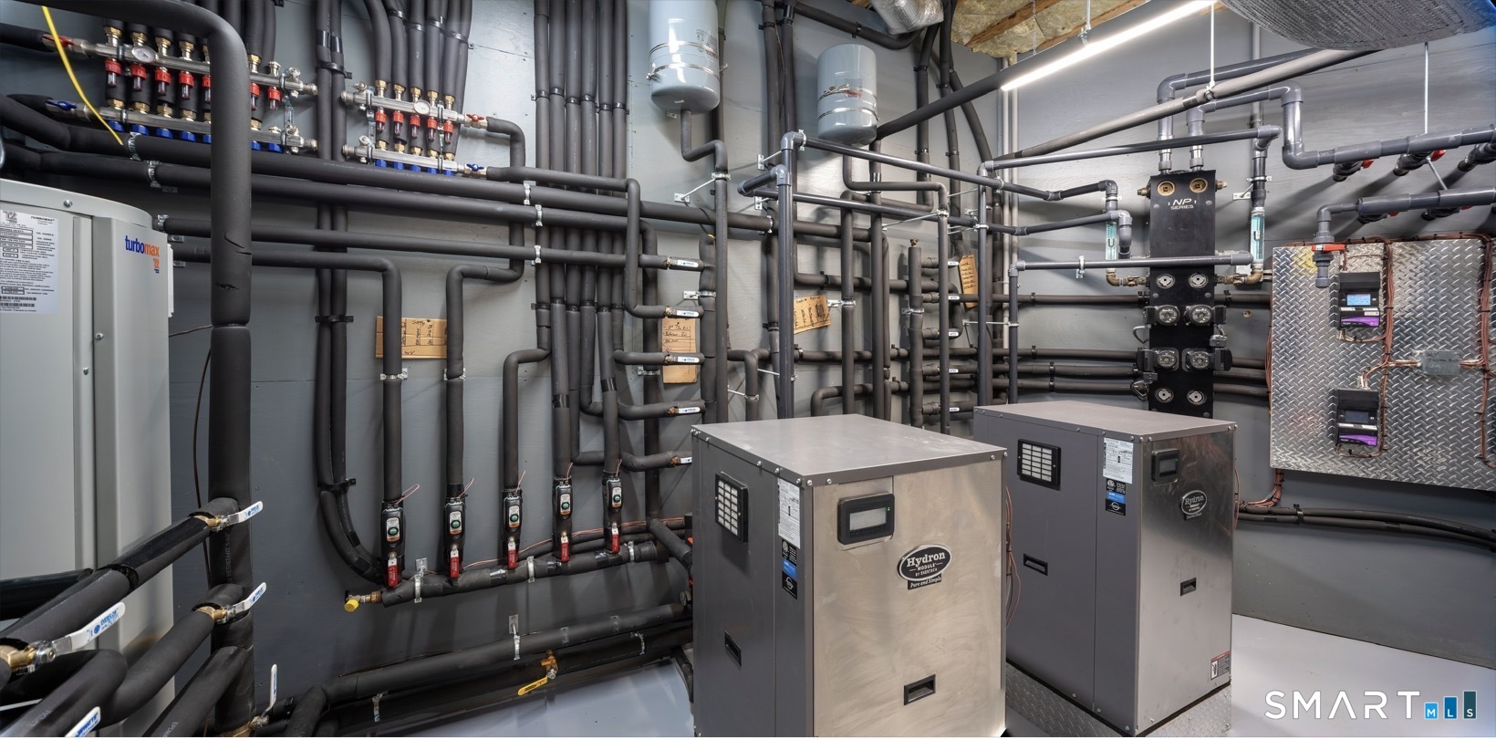 314 Ferry Road Old Lyme, CT 06371 - Photo 28 of 40 Designed with energy efficiency in mind, Greystone uses a geothermal system for both heating and cooling. A 38kw generator connects automatically during power outages fueled by a 500-gallon tank. Also on this level is a secure storage room, all mechanicals and roughed in space for a future bathroom.