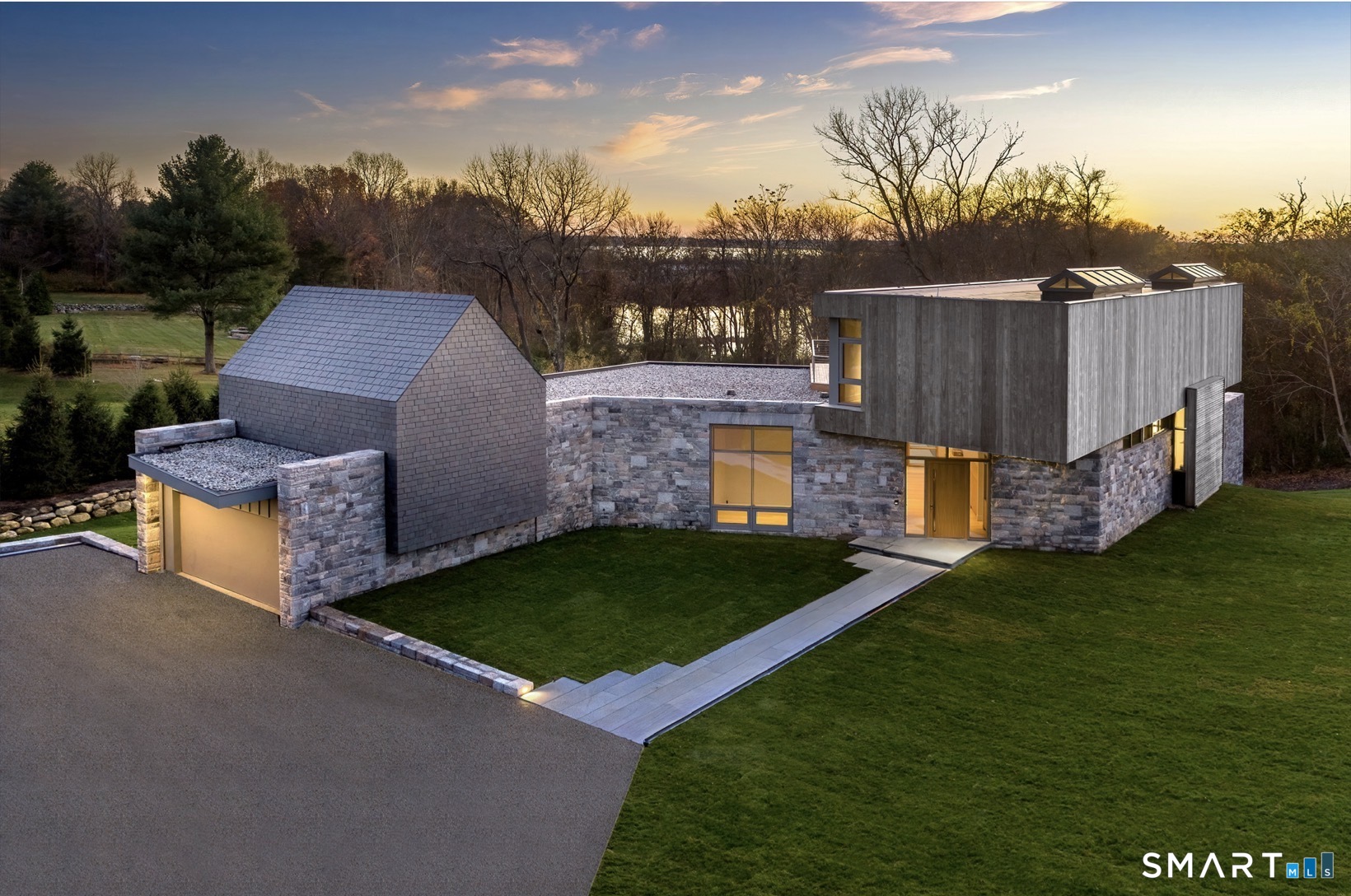 314 Ferry Road Old Lyme, CT 06371 - Photo 5 of 40 From its modest yet striking facade to its stunning 35-foot rear exposure. Greystone takes full advantage of its site's topography and orientations.