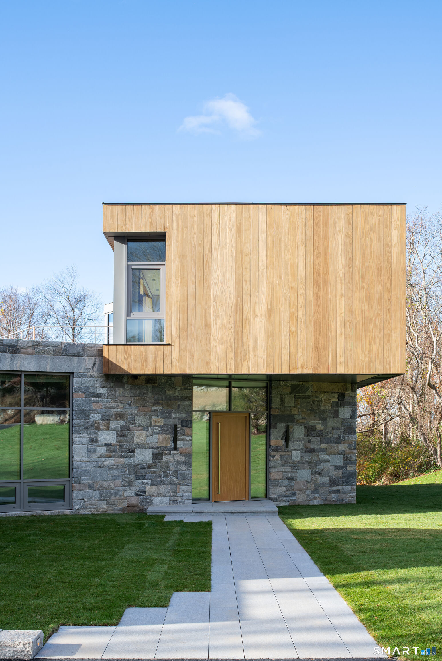 314 Ferry Road Old Lyme, CT 06371 - Photo 6 of 40 A wide granite walkway connects the driveway to the front door.