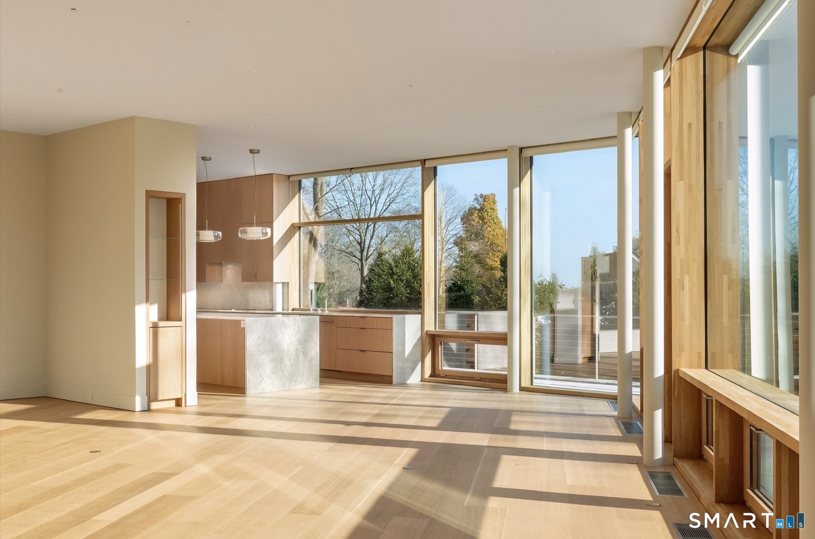 314 Ferry Road Old Lyme, CT 06371 - Photo 8 of 40 Living room opens up to a beautifully well-appointed contemporary kitchen.