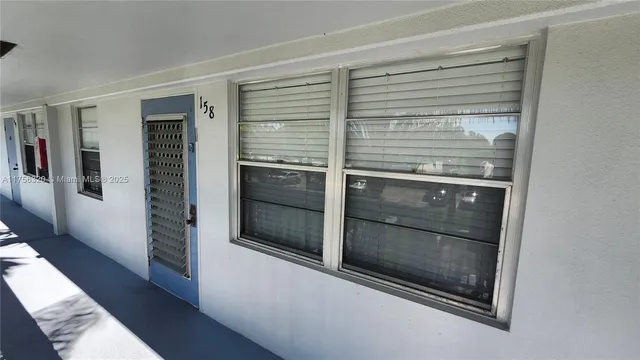 a kitchen with a refrigerator and a stove