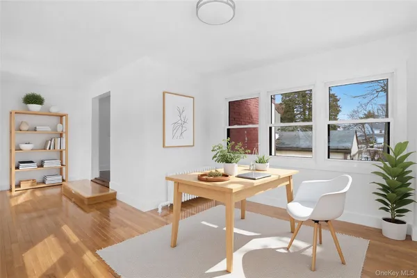 a dining room with furniture and window