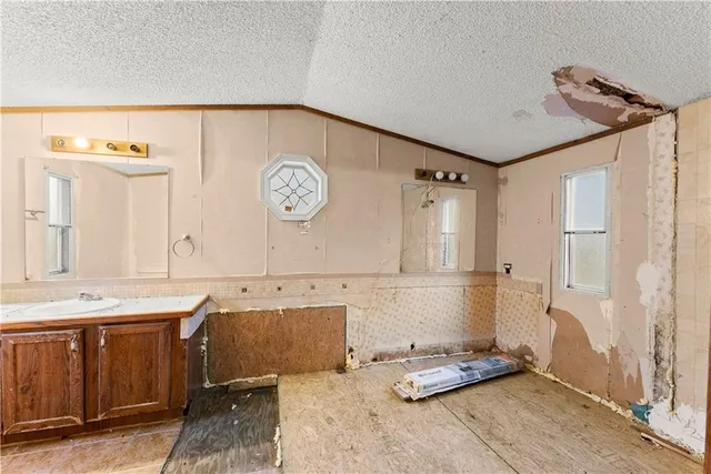 a bathroom with a tub and shower