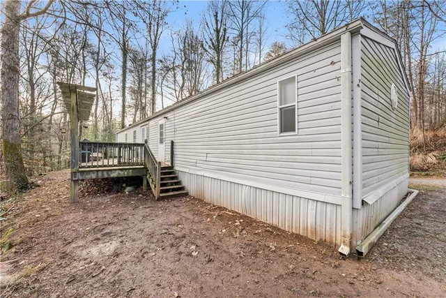 a balcony with wooden benches and couches