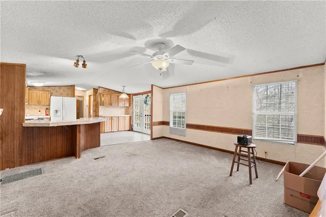 a view of a kitchen with a sink and a cabinet