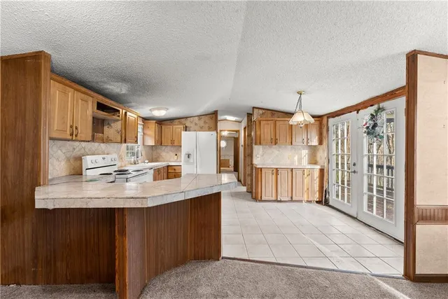 a kitchen with furniture and a stove