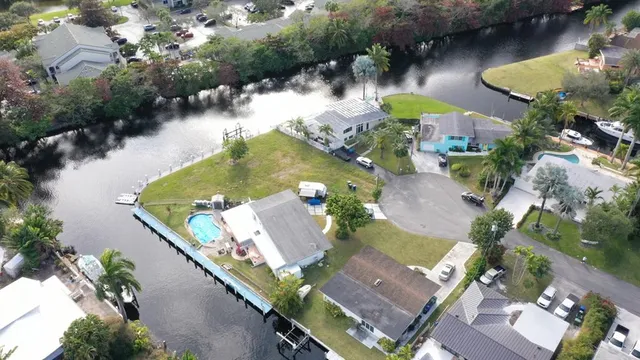 an aerial view of a house with a lake view