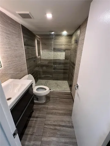 a bathroom with a sink and toilet