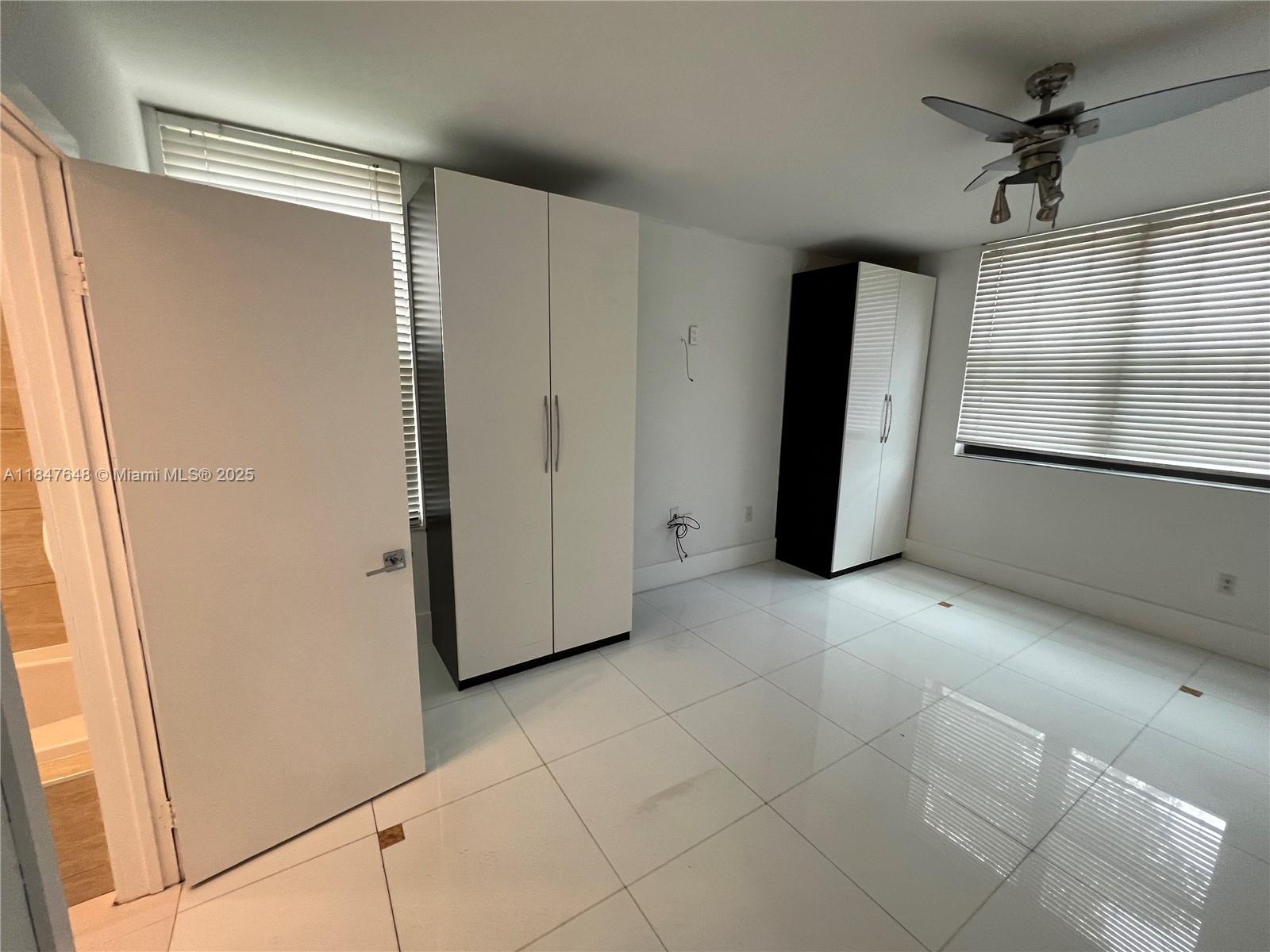 Ives Estates Miami, FL 33179 - Photo 16 of 18 a view of an empty room with a window