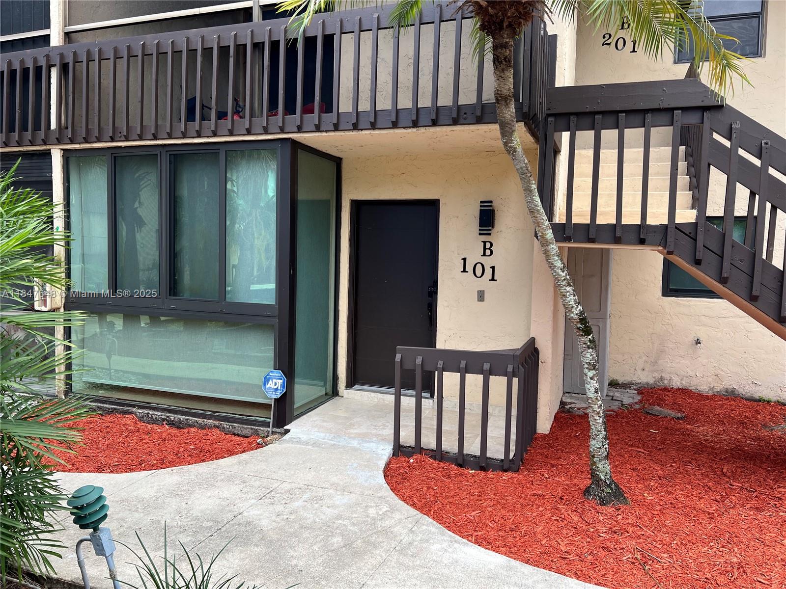 Ives Estates Miami, FL 33179 - Photo 2 of 18 a balcony with table and chairs