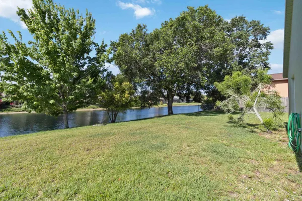 a swimming pool with wooden fence