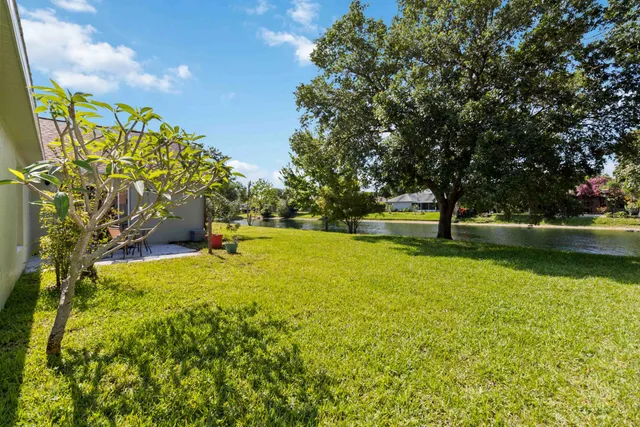 a view of a lake with a house in the background