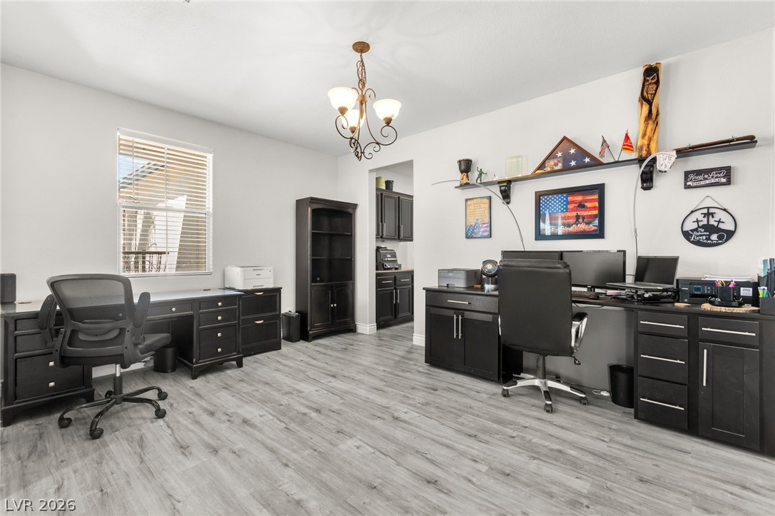 5601 Rocky Ravine Avenue Las Vegas, NV 89131 - Photo 12 of 71 Office space featuring suspended lighting and light wood-style floors