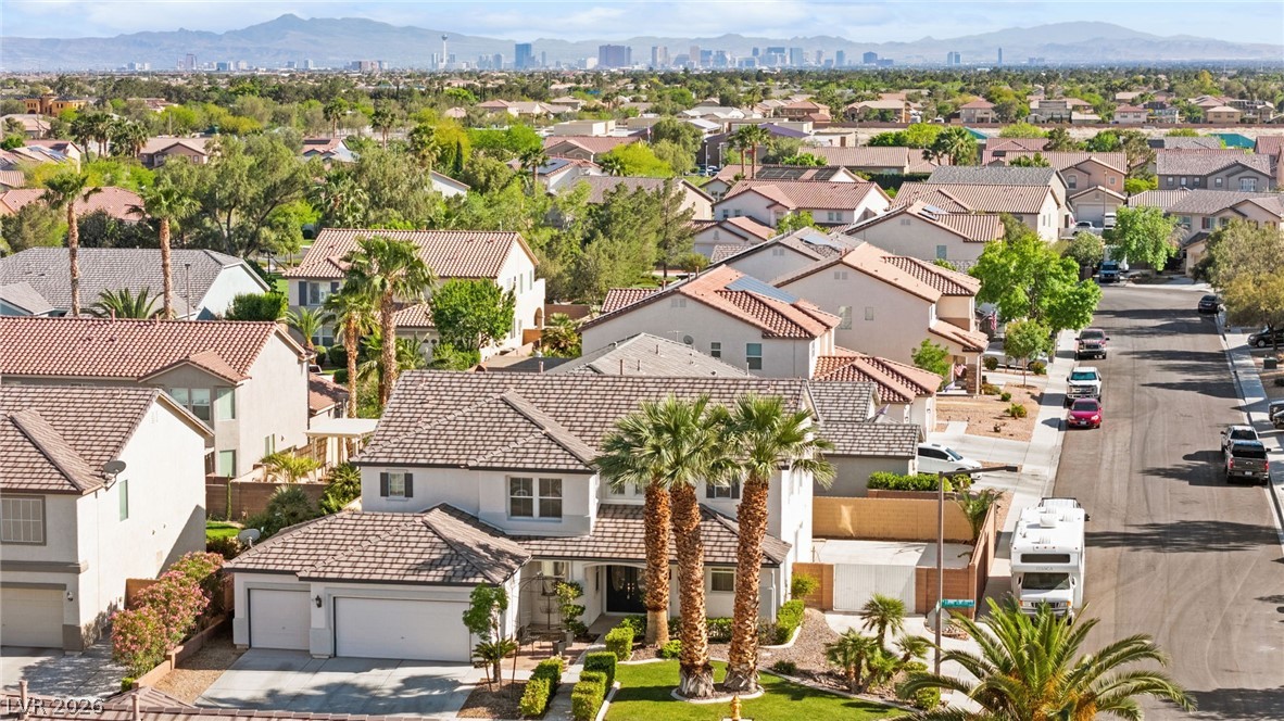 5601 Rocky Ravine Avenue Las Vegas, NV 89131 - Photo 3 of 71 Aerial perspective of suburban area with a mountain backdrop
