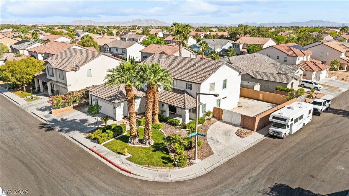 5601 Rocky Ravine Avenue Las Vegas, NV 89131 - Photo 5 of 71 Aerial view of residential area with a mountainous background