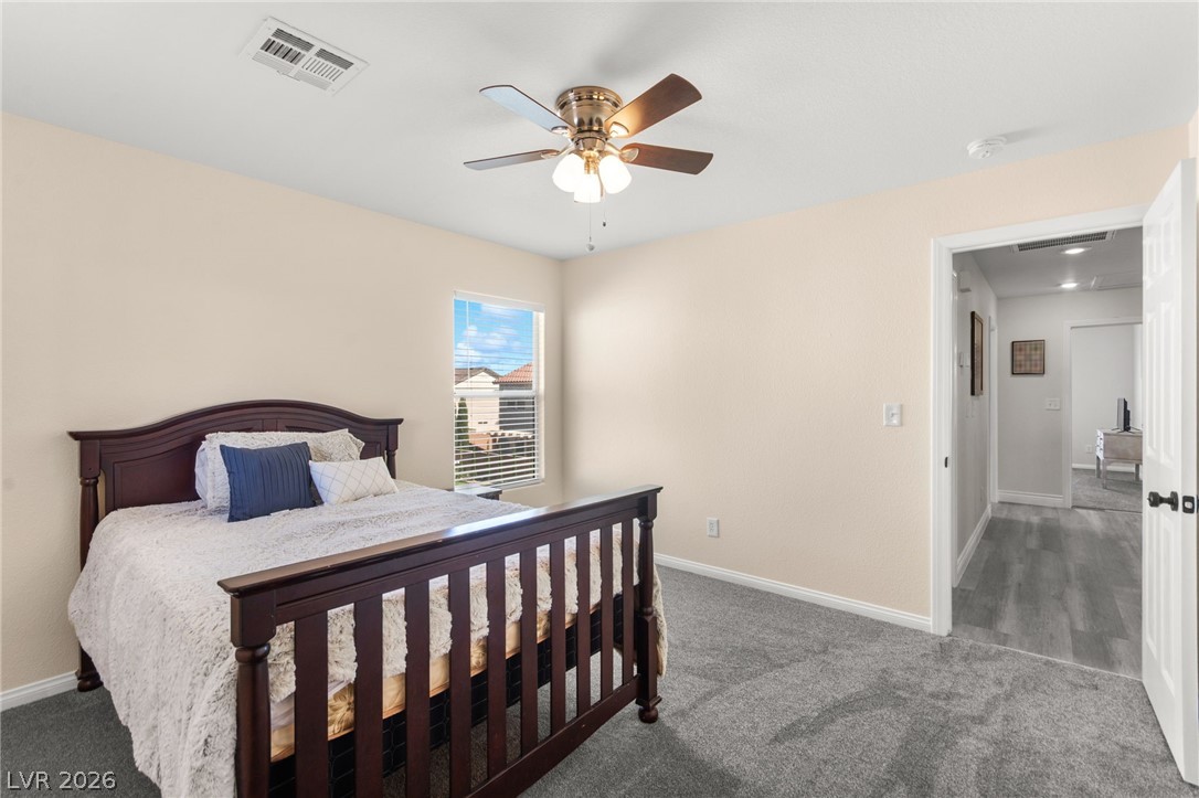 5601 Rocky Ravine Avenue Las Vegas, NV 89131 - Photo 57 of 71 Bedroom featuring carpet and ceiling fan