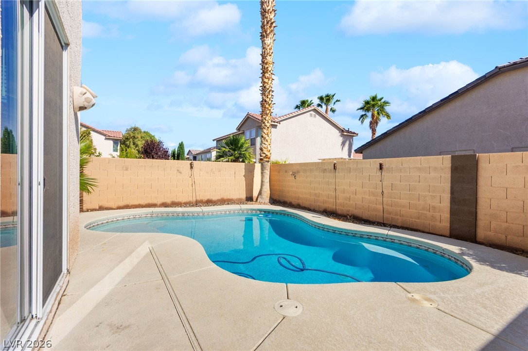 5601 Rocky Ravine Avenue Las Vegas, NV 89131 - Photo 68 of 71 View of swimming pool with a fenced backyard and patio surround