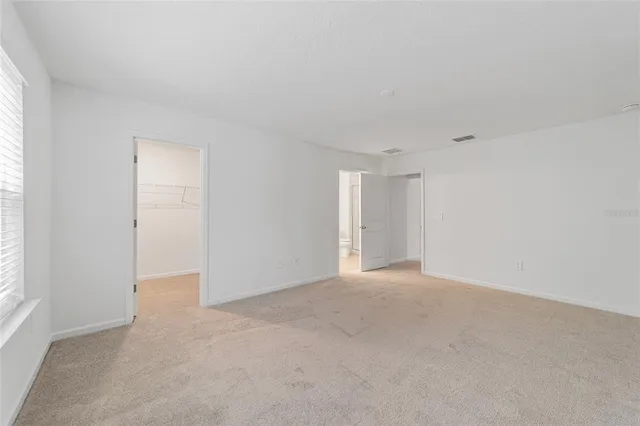 a bathroom with a shower a toilet and a sink