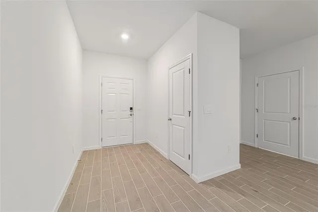 a view of an empty room with a window