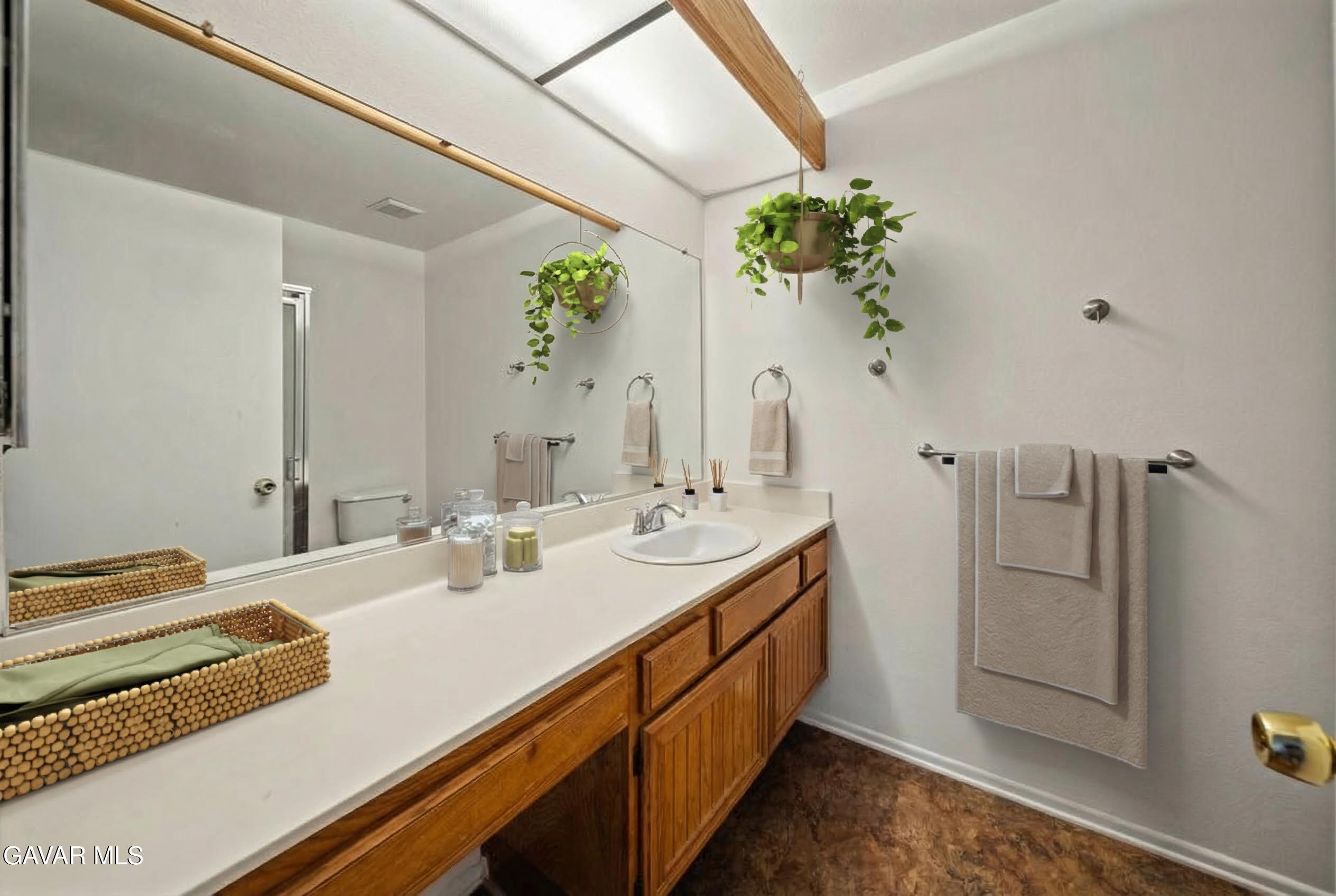 20345 Rue Crevier, Unit 507 Santa Clarita, CA 91351 - Photo 11 of 20 a bathroom with a double vanity sink and a mirror