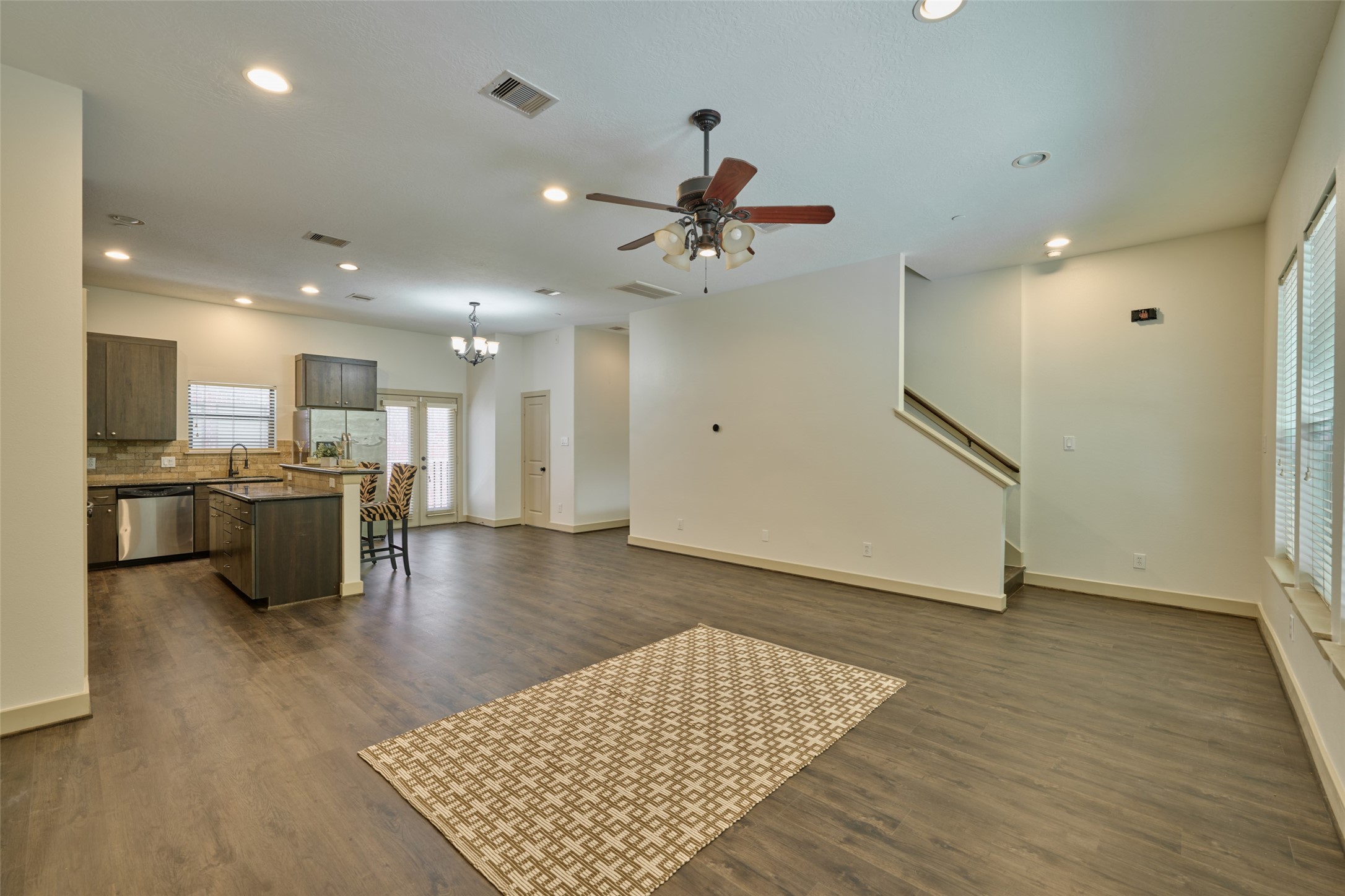 2422 Navigation Boulevard, Unit E Houston, TX 77003 - Photo 11 of 29 a view of kitchen with cabinets and wooden floor