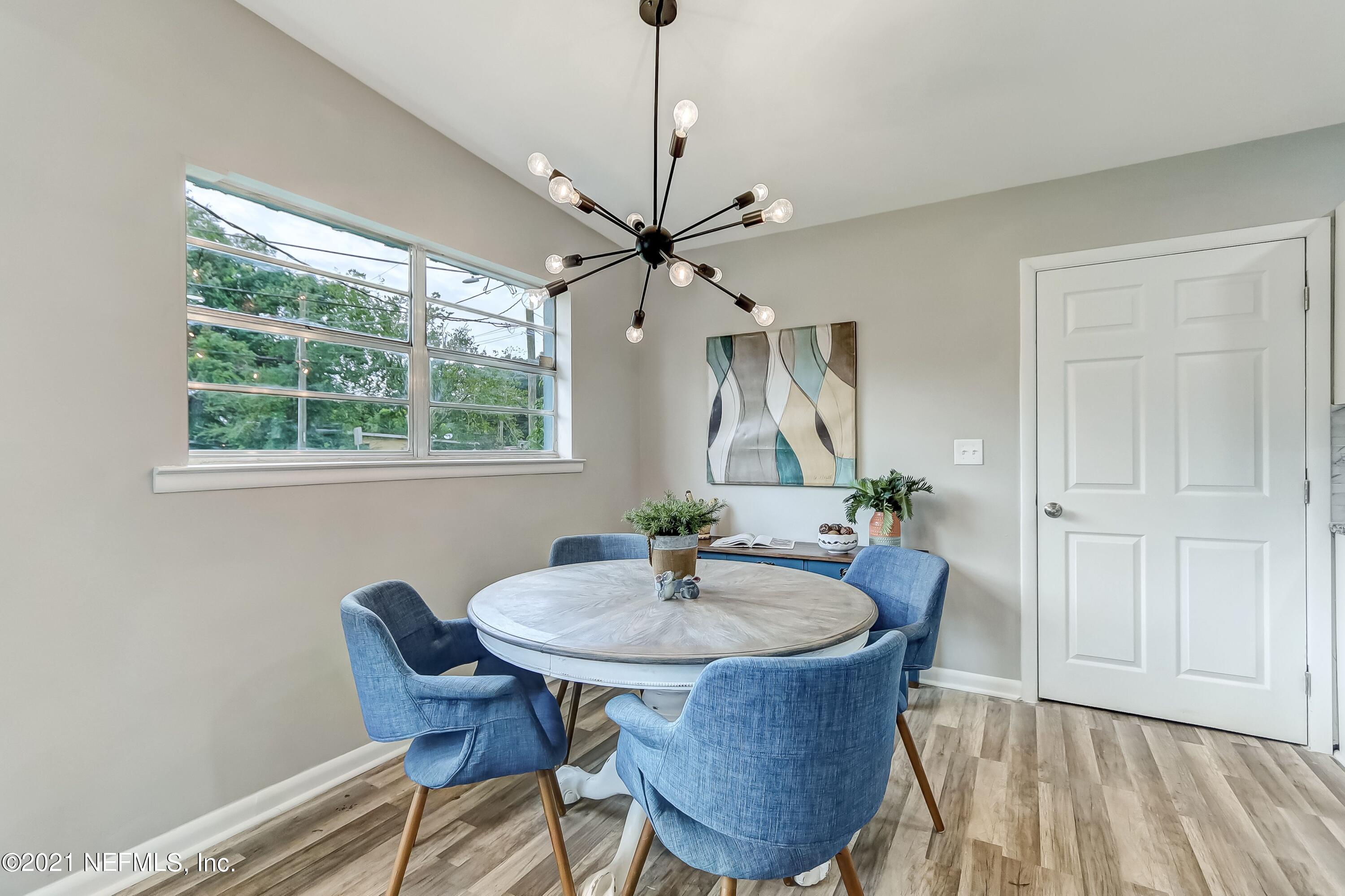 6914 Rollo Road Jacksonville, FL 32205 - Photo 11 of 31 a dining room with furniture and window