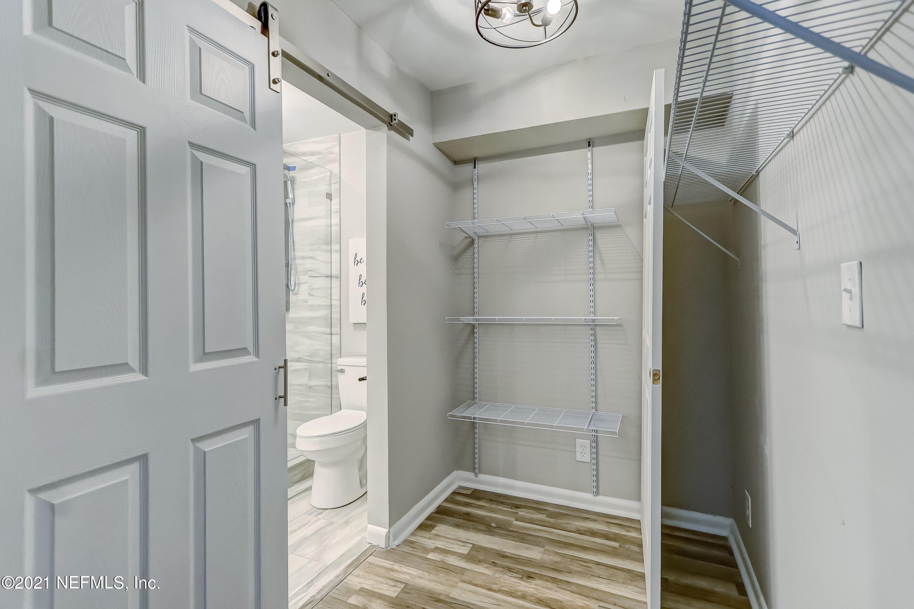6914 Rollo Road Jacksonville, FL 32205 - Photo 24 of 31 a bathroom with a shower and a toilet