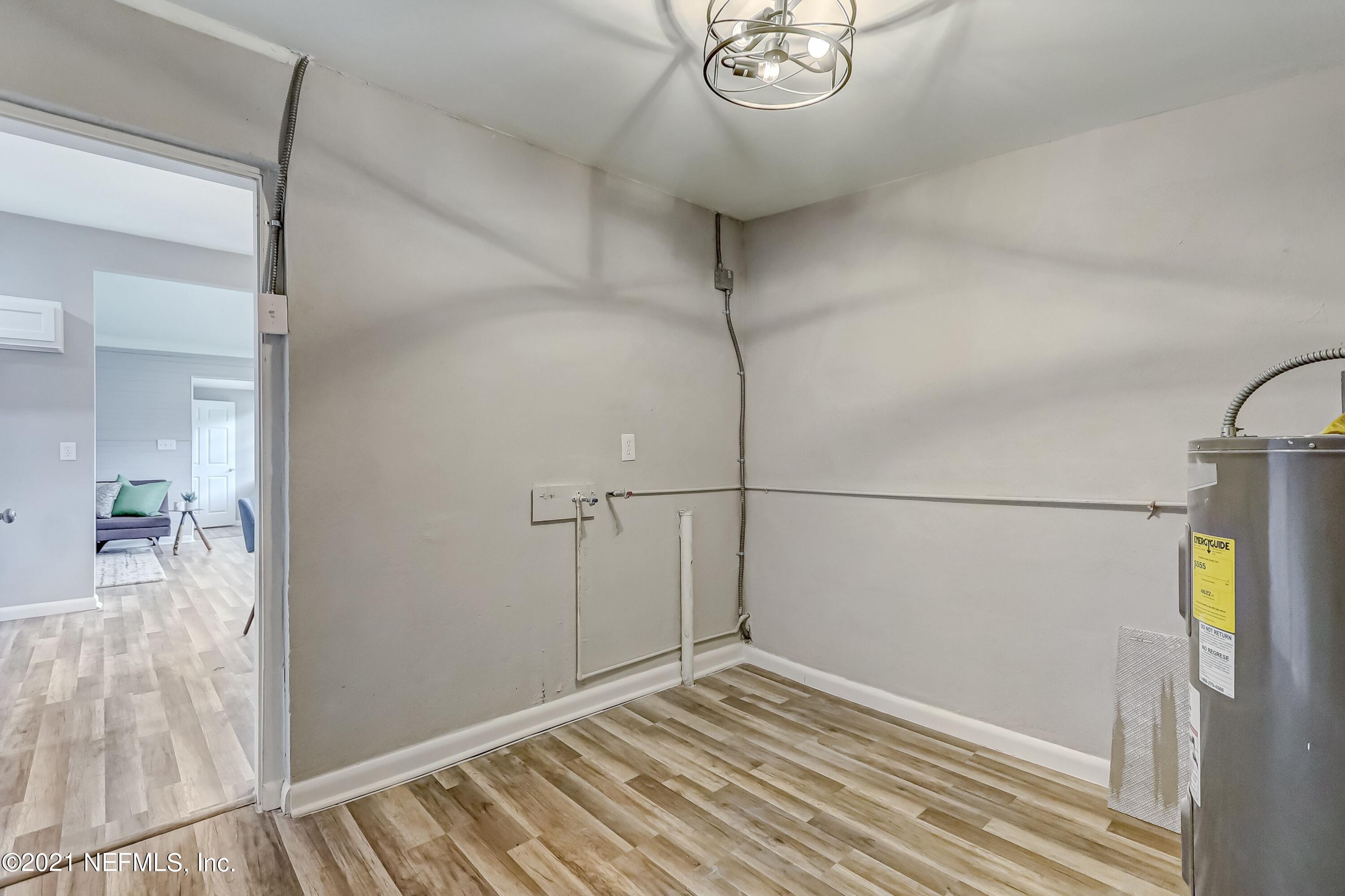 6914 Rollo Road Jacksonville, FL 32205 - Photo 28 of 31 a view of a room with wooden floor