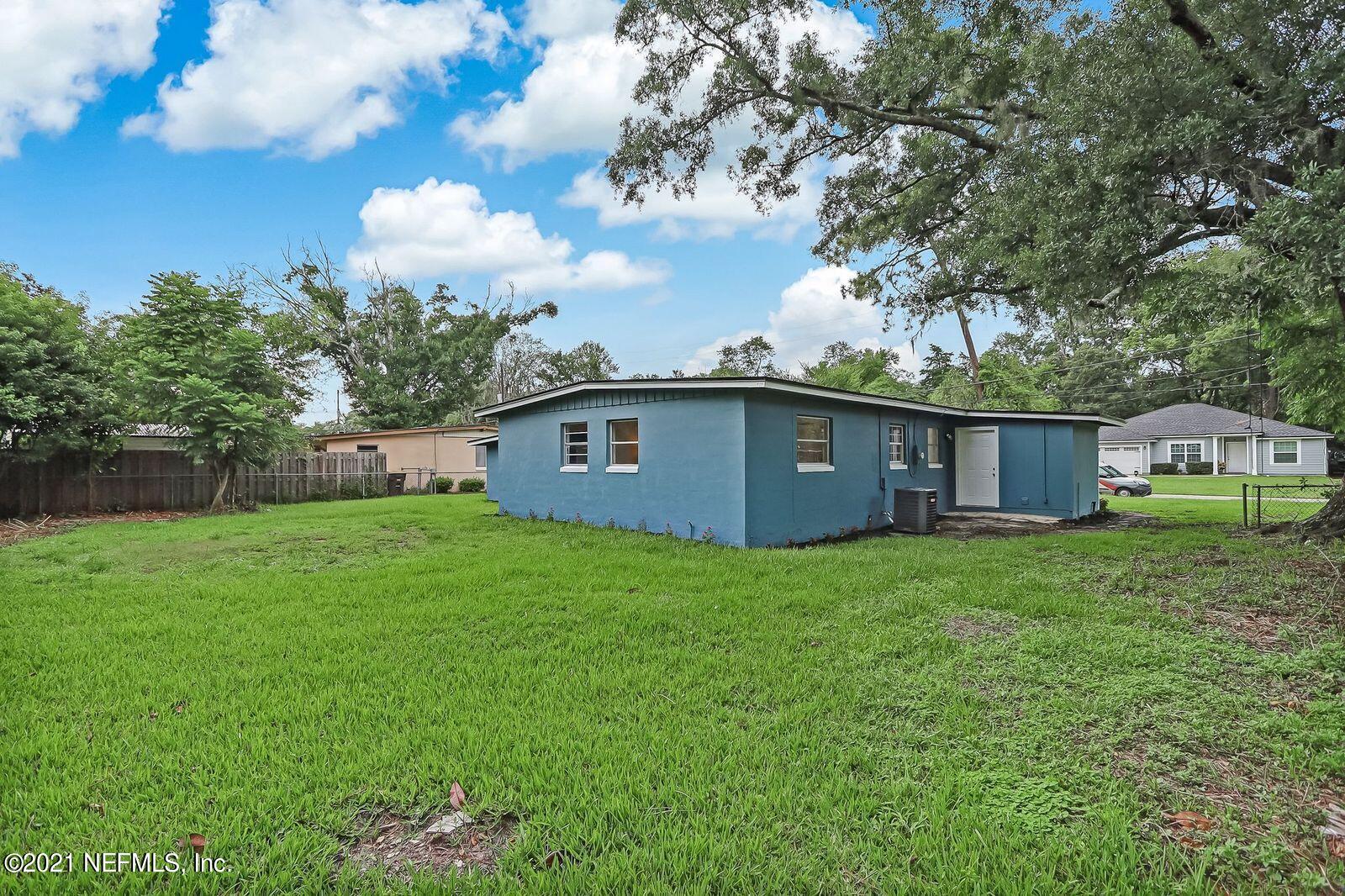 6914 Rollo Road Jacksonville, FL 32205 - Photo 29 of 31 a view of a house with backyard and garden