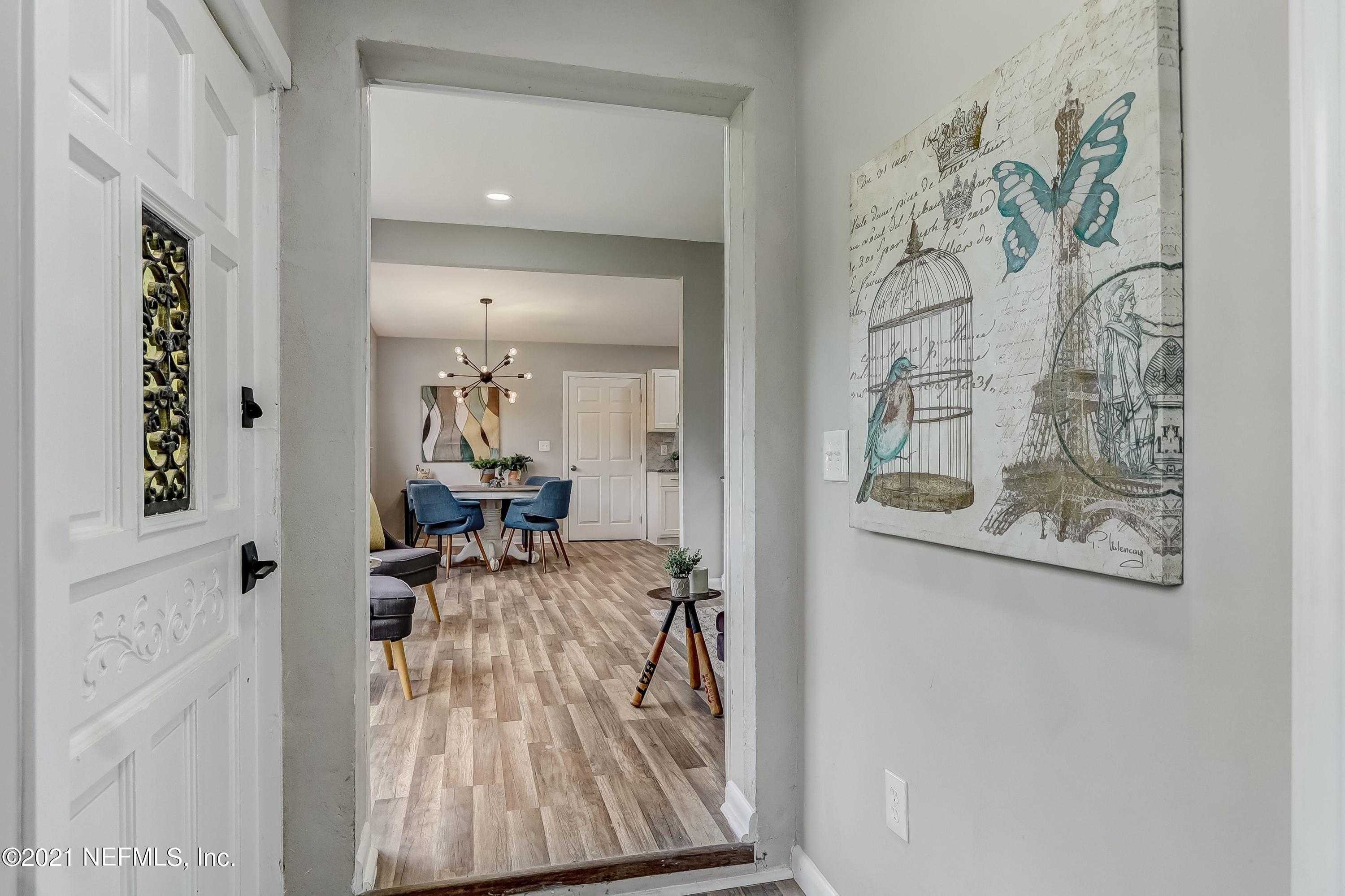 6914 Rollo Road Jacksonville, FL 32205 - Photo 6 of 31 a view of living room filled with furniture and wooden floor