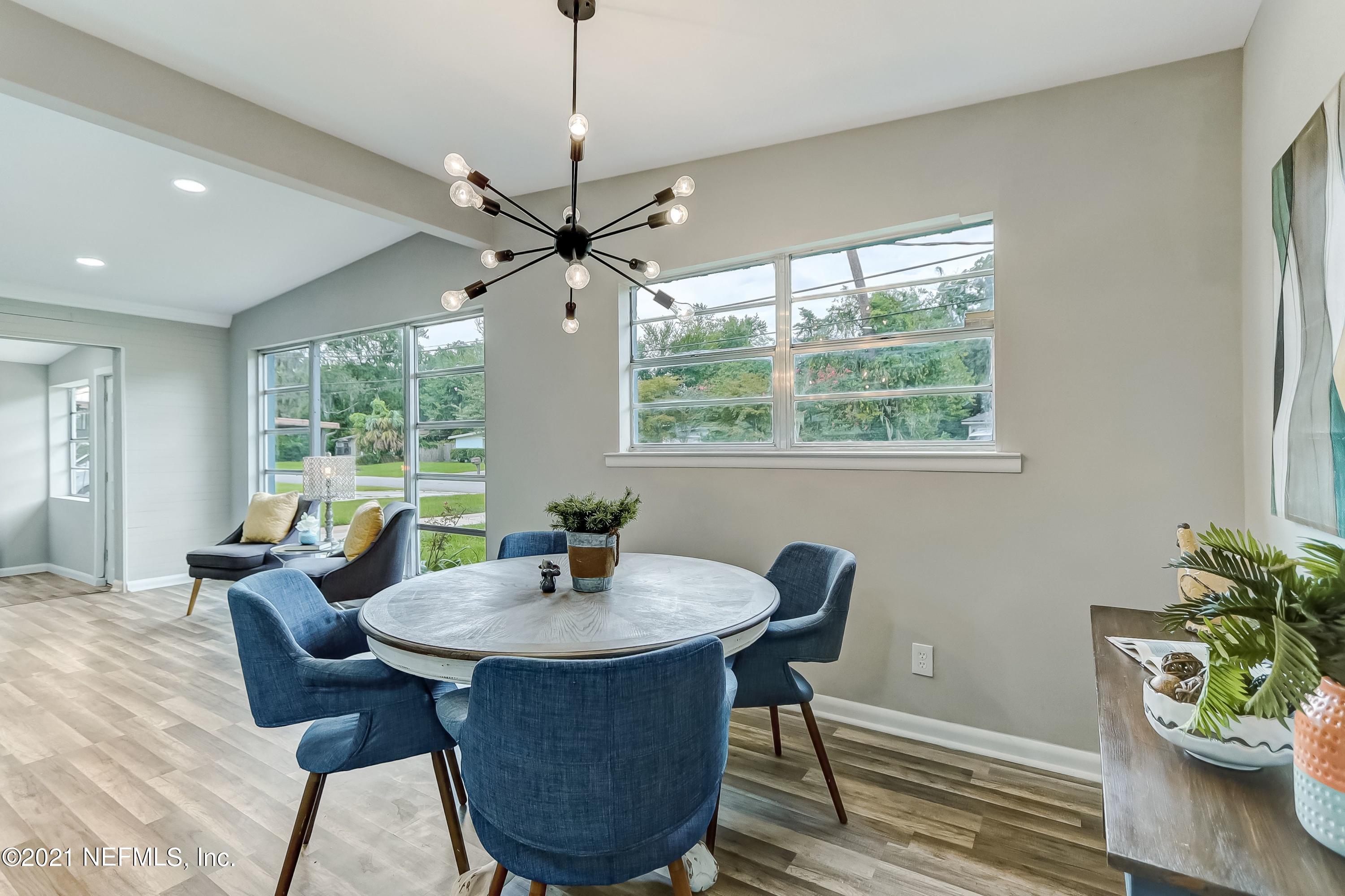 6914 Rollo Road Jacksonville, FL 32205 - Photo 10 of 31 a view of a dining room with furniture window and outside view