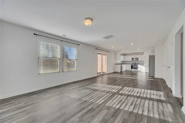 a view of kitchen and wooden floor