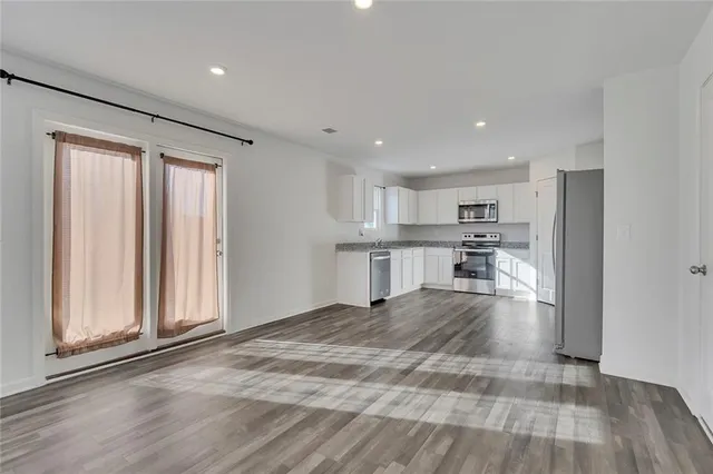 a view of kitchen with wooden floor