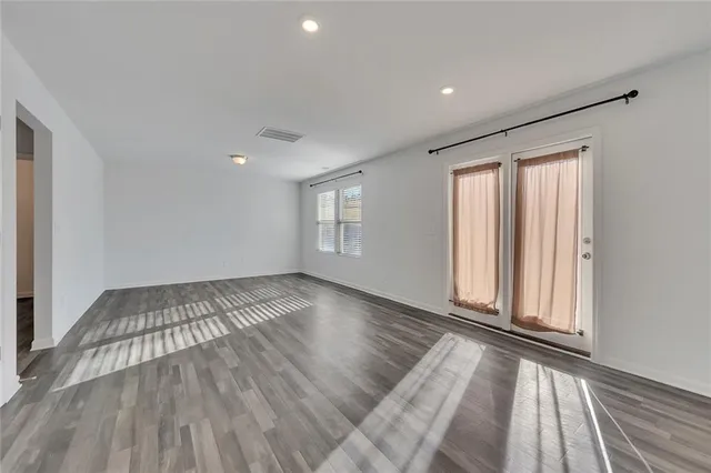a view of an empty room and a window