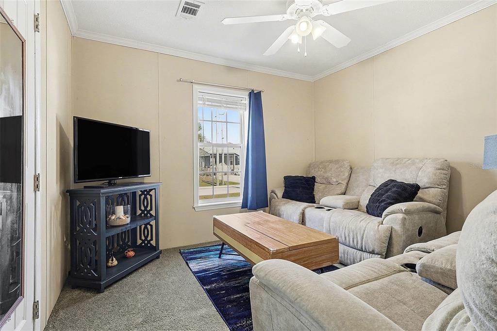 11305 Pineapple Road Punta Gorda, FL 33955 - Photo 14 of 30 a living room with furniture and a flat screen tv