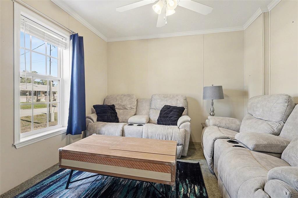 11305 Pineapple Road Punta Gorda, FL 33955 - Photo 15 of 30 a living room with furniture and a window
