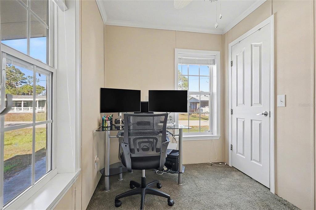 11305 Pineapple Road Punta Gorda, FL 33955 - Photo 17 of 30 a view of a livingroom with workspace and a window