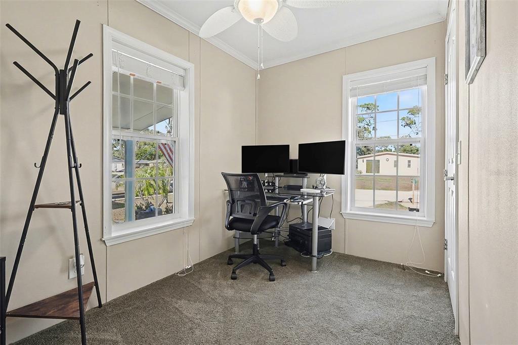 11305 Pineapple Road Punta Gorda, FL 33955 - Photo 18 of 30 a view of a workspace with furniture and a window