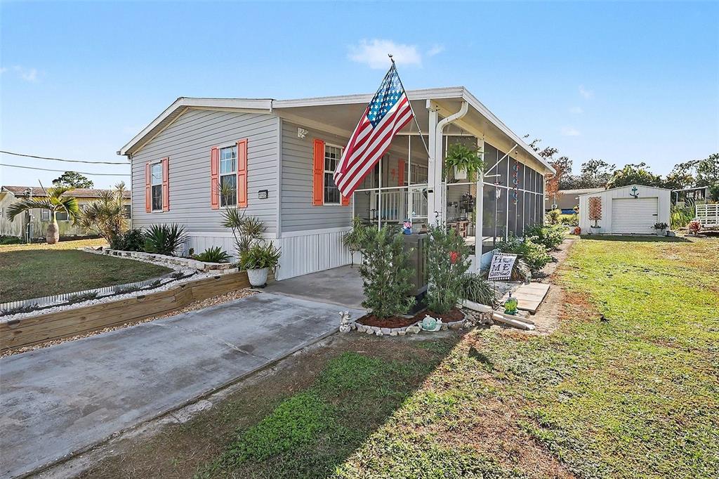 11305 Pineapple Road Punta Gorda, FL 33955 - Photo 2 of 30 a view of a house with yard and sitting area