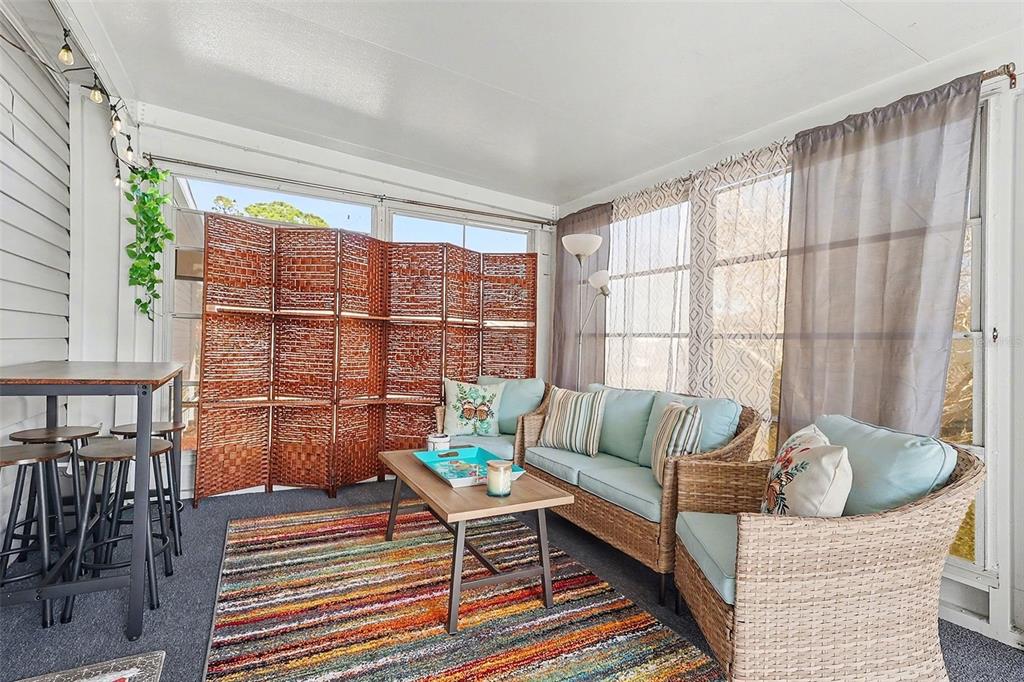 11305 Pineapple Road Punta Gorda, FL 33955 - Photo 21 of 30 a living room with furniture and a large window