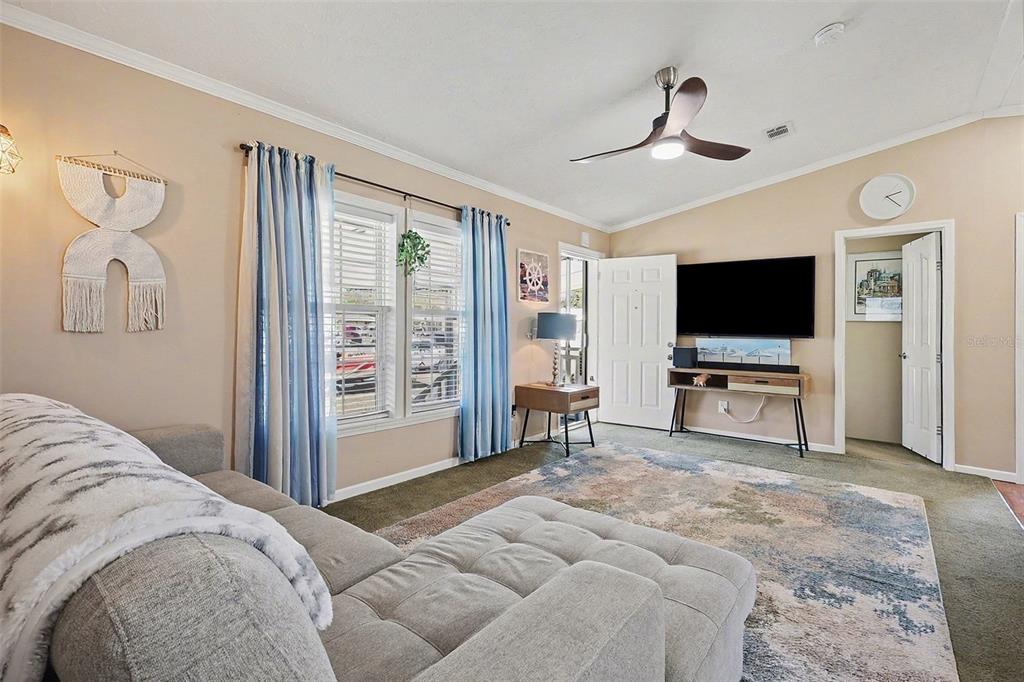 11305 Pineapple Road Punta Gorda, FL 33955 - Photo 3 of 30 a bedroom with a bed and a flat screen tv