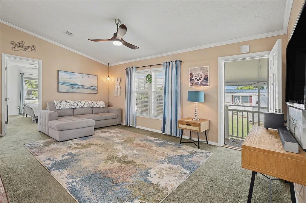 11305 Pineapple Road Punta Gorda, FL 33955 - Photo 4 of 30 a living room with furniture and a flat screen tv